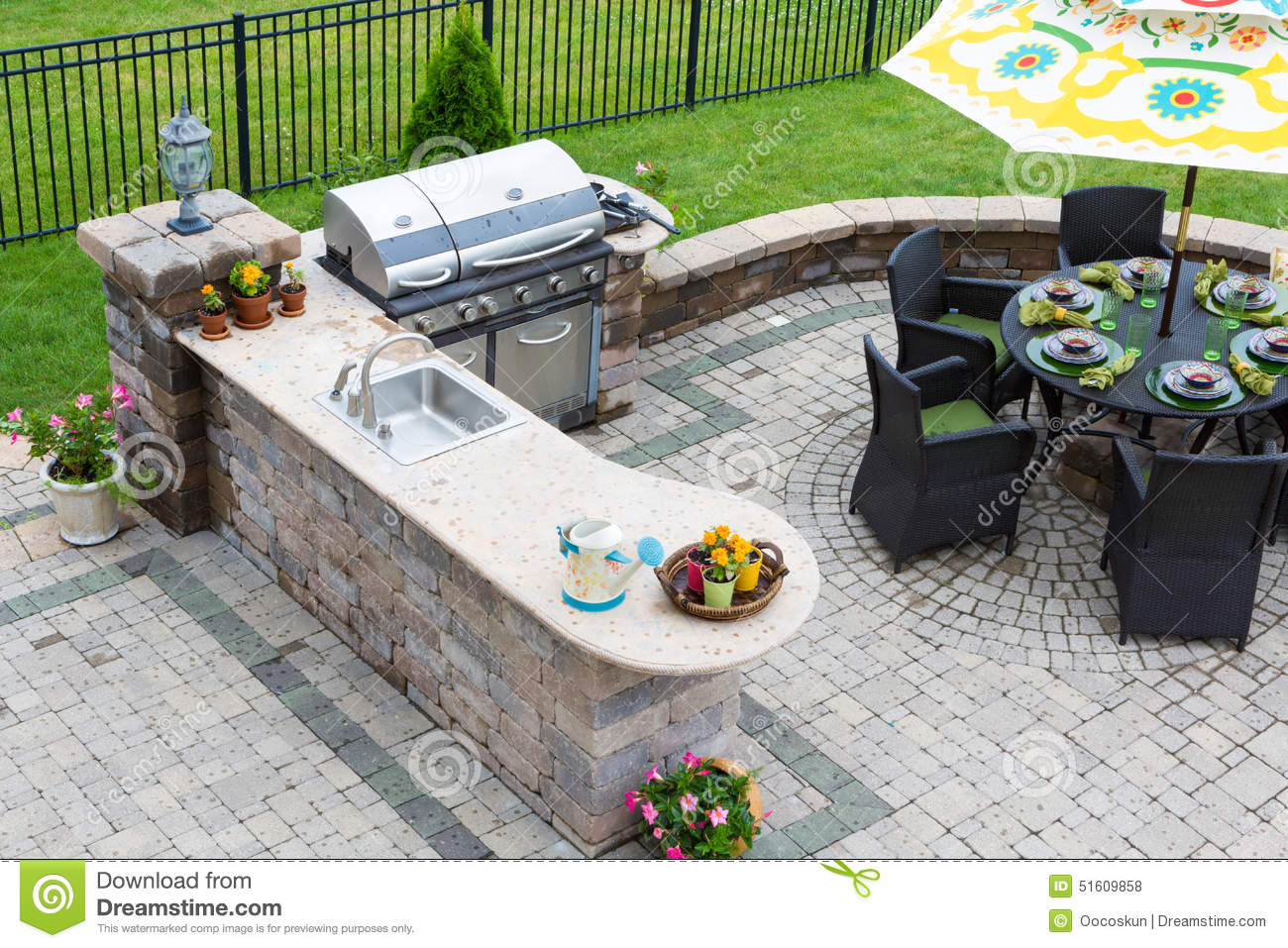 outdoor-kitchen-dining-table-paved-patio-high-angle-view-stylish-gas-barbecue-set-entertaining-guests-formal-51609858